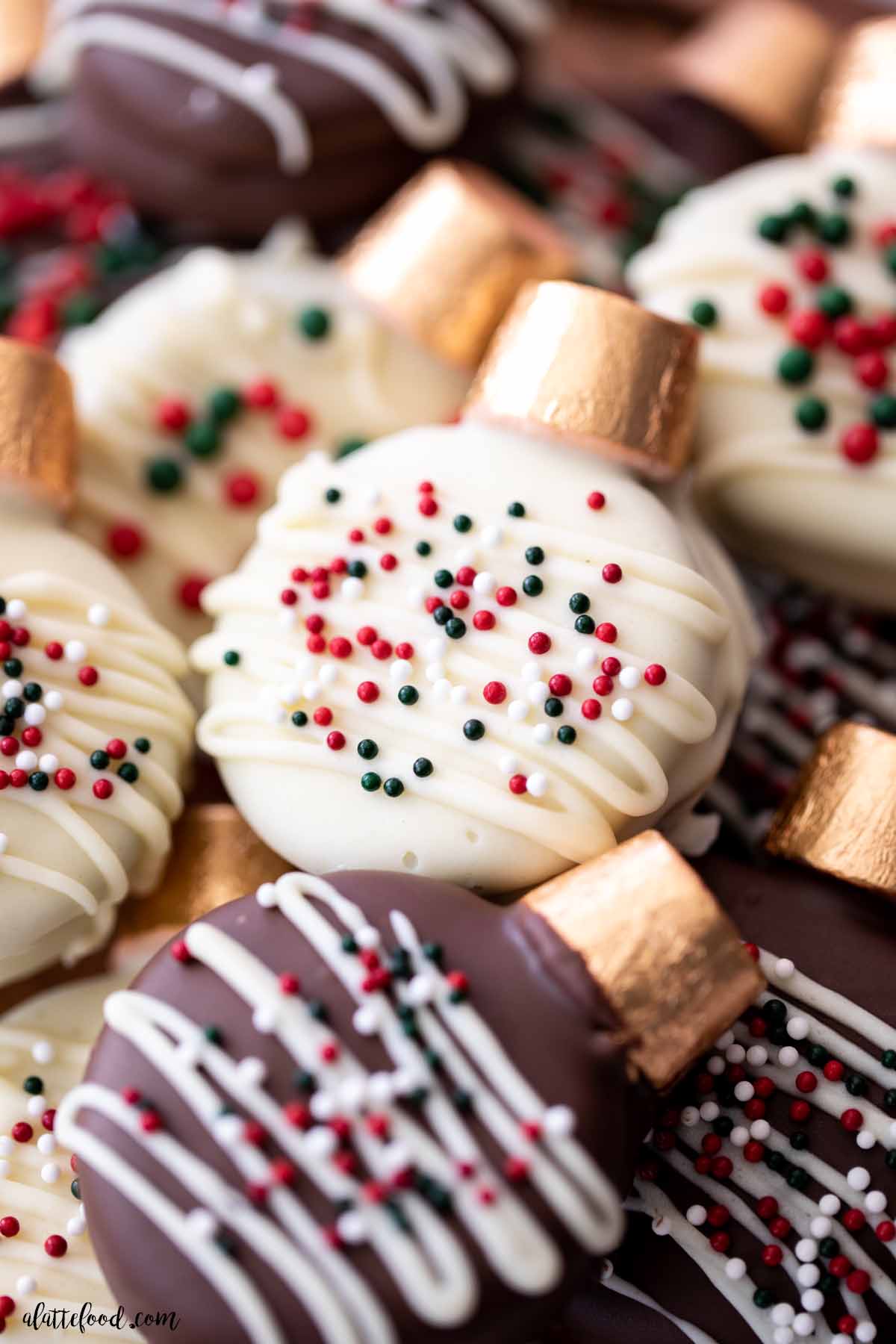 sprinkle covered oreo christmas cookies with rolos and peanut butter.